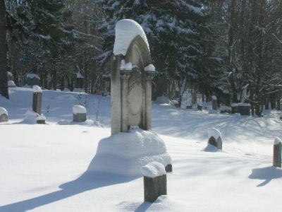 Snow Covered Tombstone Pillar